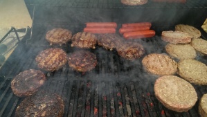Steak Burgers, and Roseda Hot Dogs on the grill